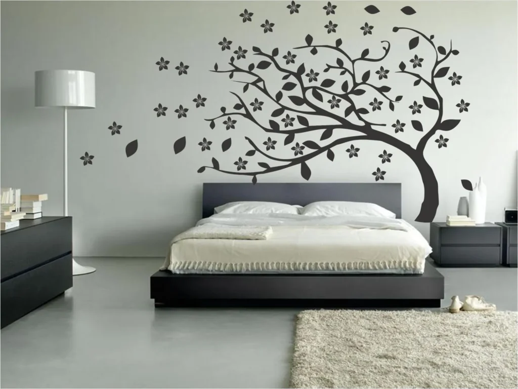 Dormitorio moderno con vinilo de árbol en pared blanca